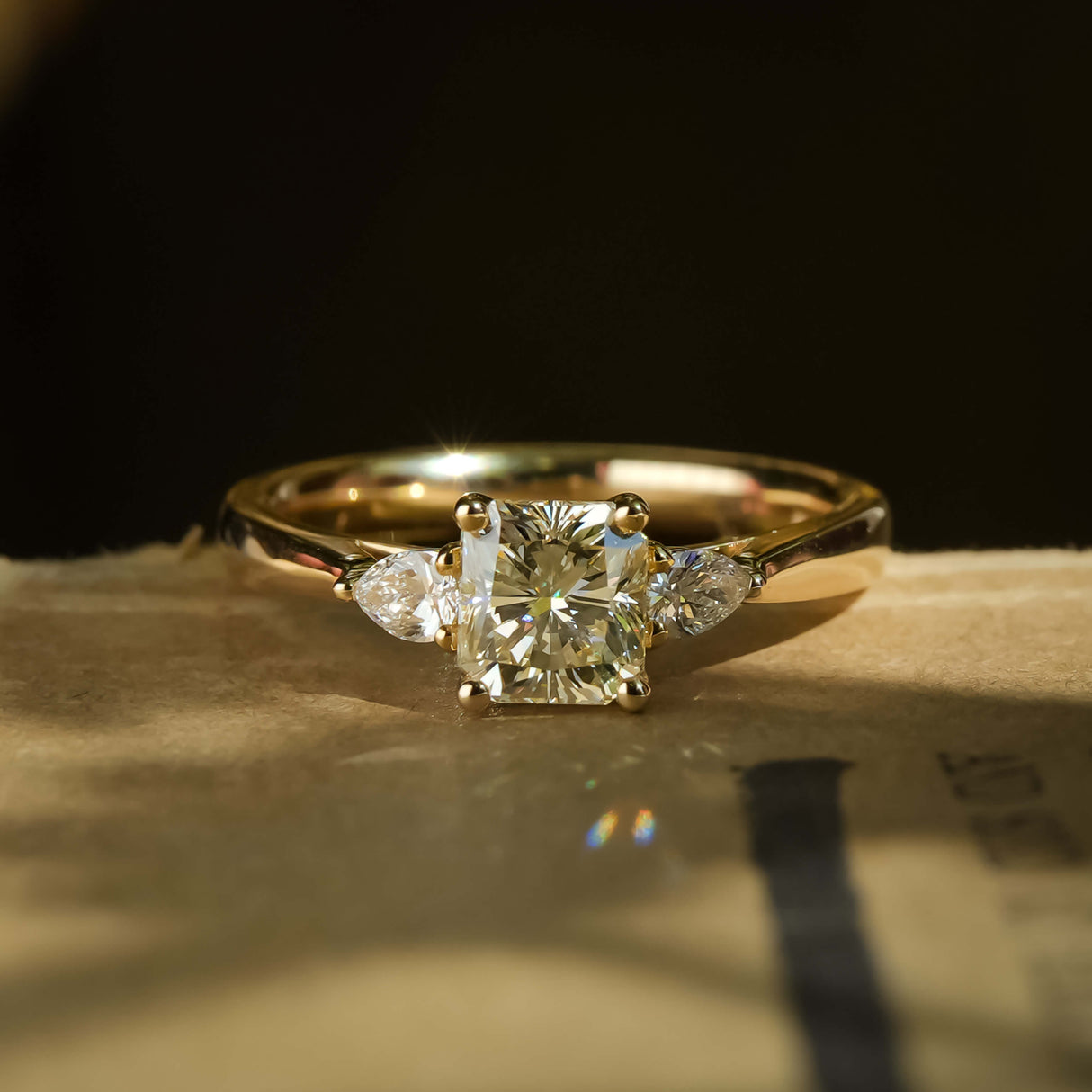 1.01ct yellow diamond and diamond three stone engagement ring in classic yellow gold setting