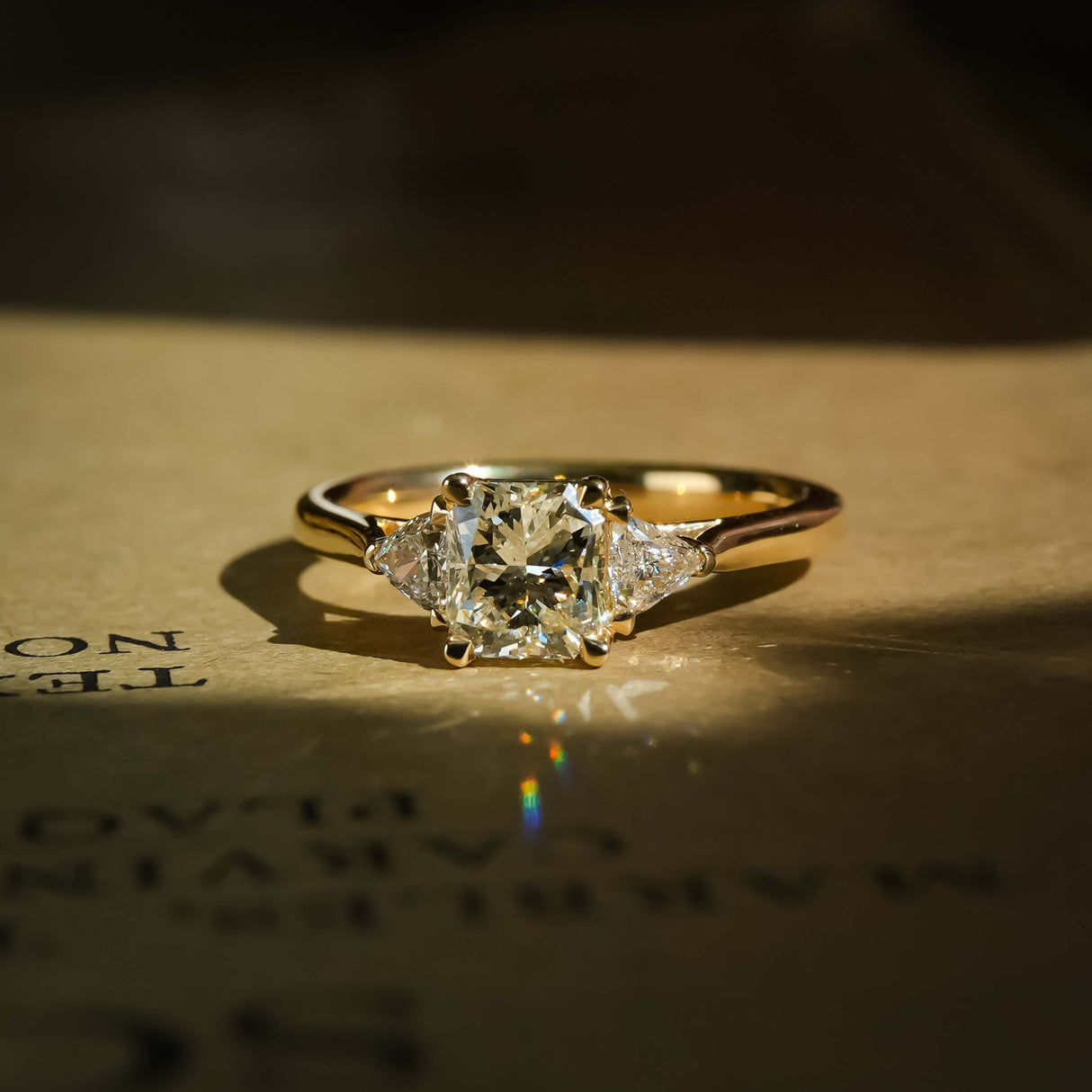 1.07ct diamond and diamond three stone engagement ring in yellow gold setting