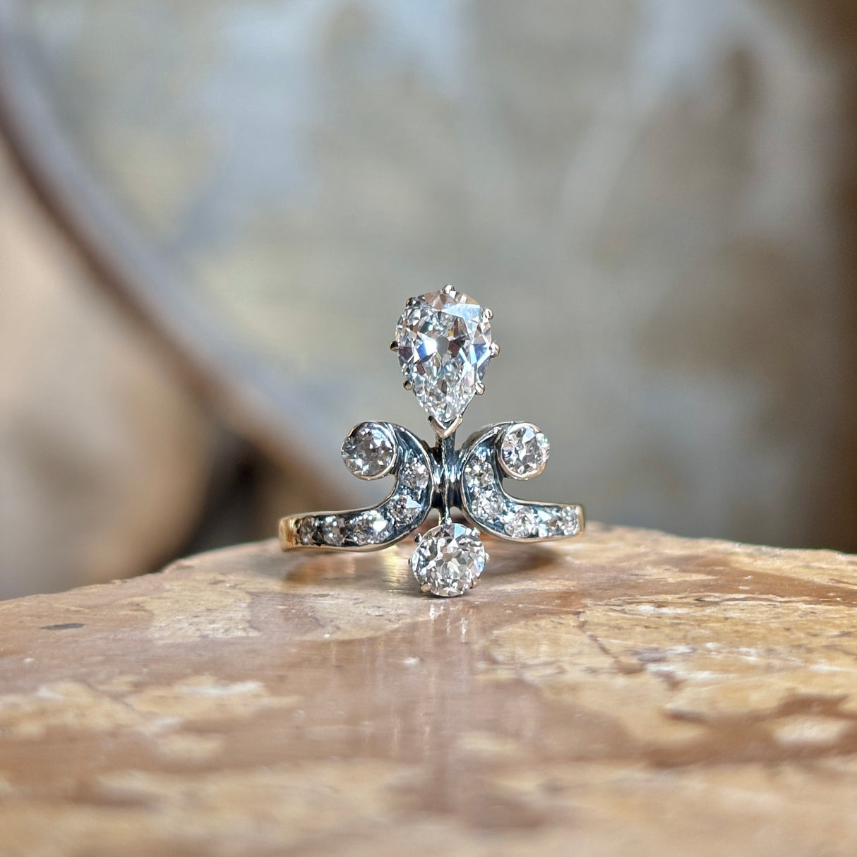 Antique, Edwardian pear cut diamond motif engagement ring