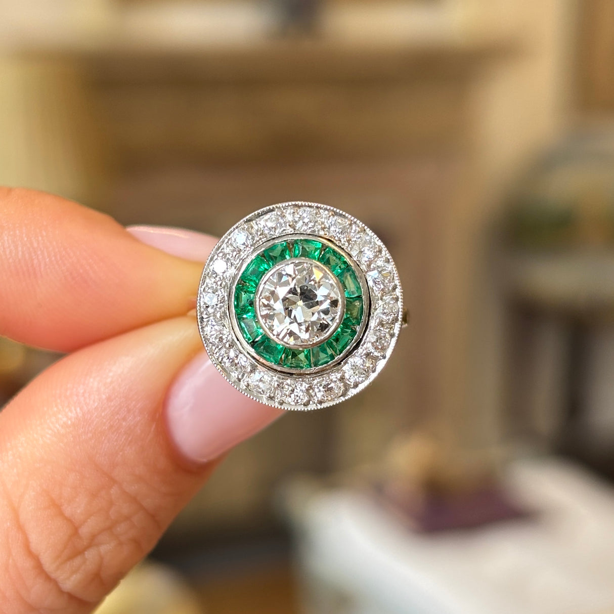 Art Deco emerald & diamond target cluster ring, circa 1920s
