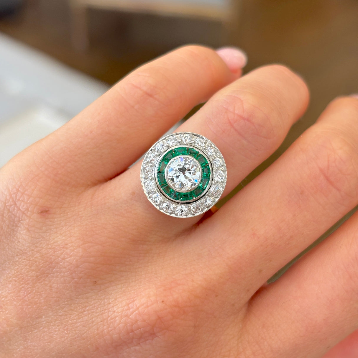 Art Deco emerald & diamond target cluster ring, circa 1920s