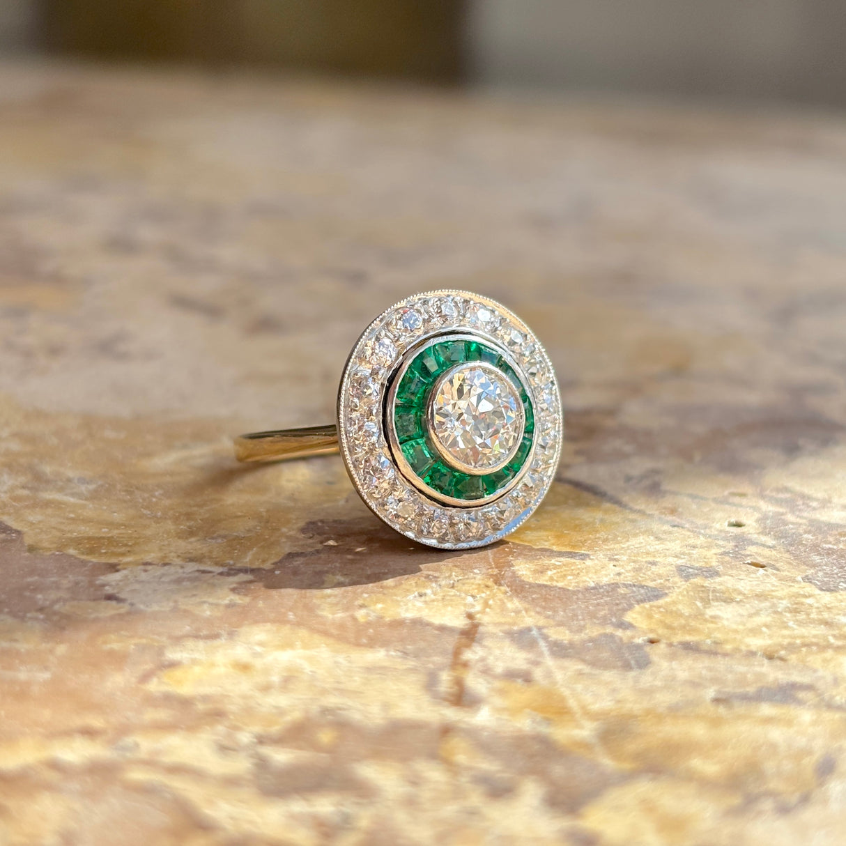 Art Deco emerald & diamond target cluster ring, circa 1920s