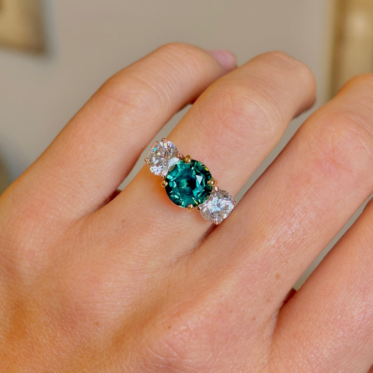 Vintage, teal sapphire and diamond three-stone engagement ring