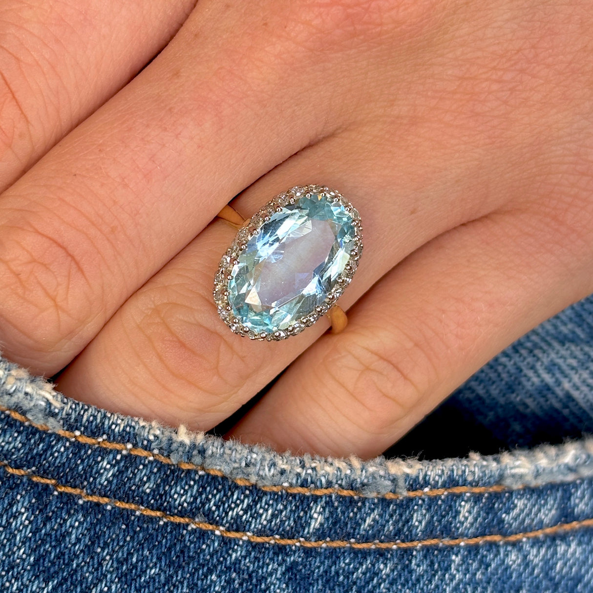 Vintage, 1940s aquamarine and diamond cocktail ring worn on hand.