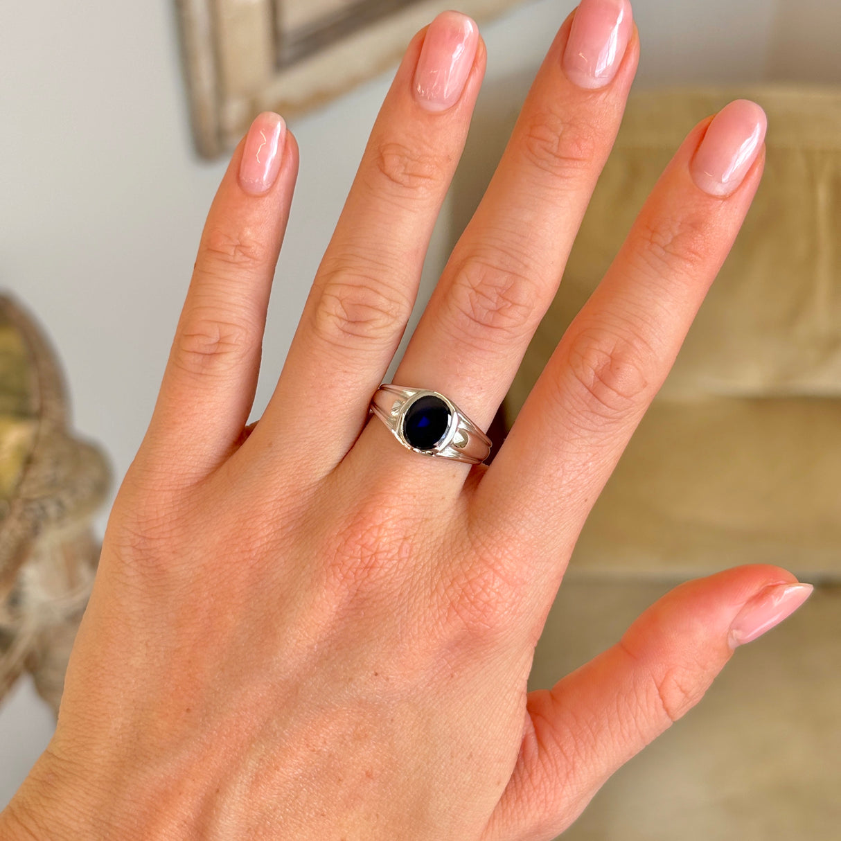 Vintage, Tiffany & Co. single-stone sapphire ring worn on hand