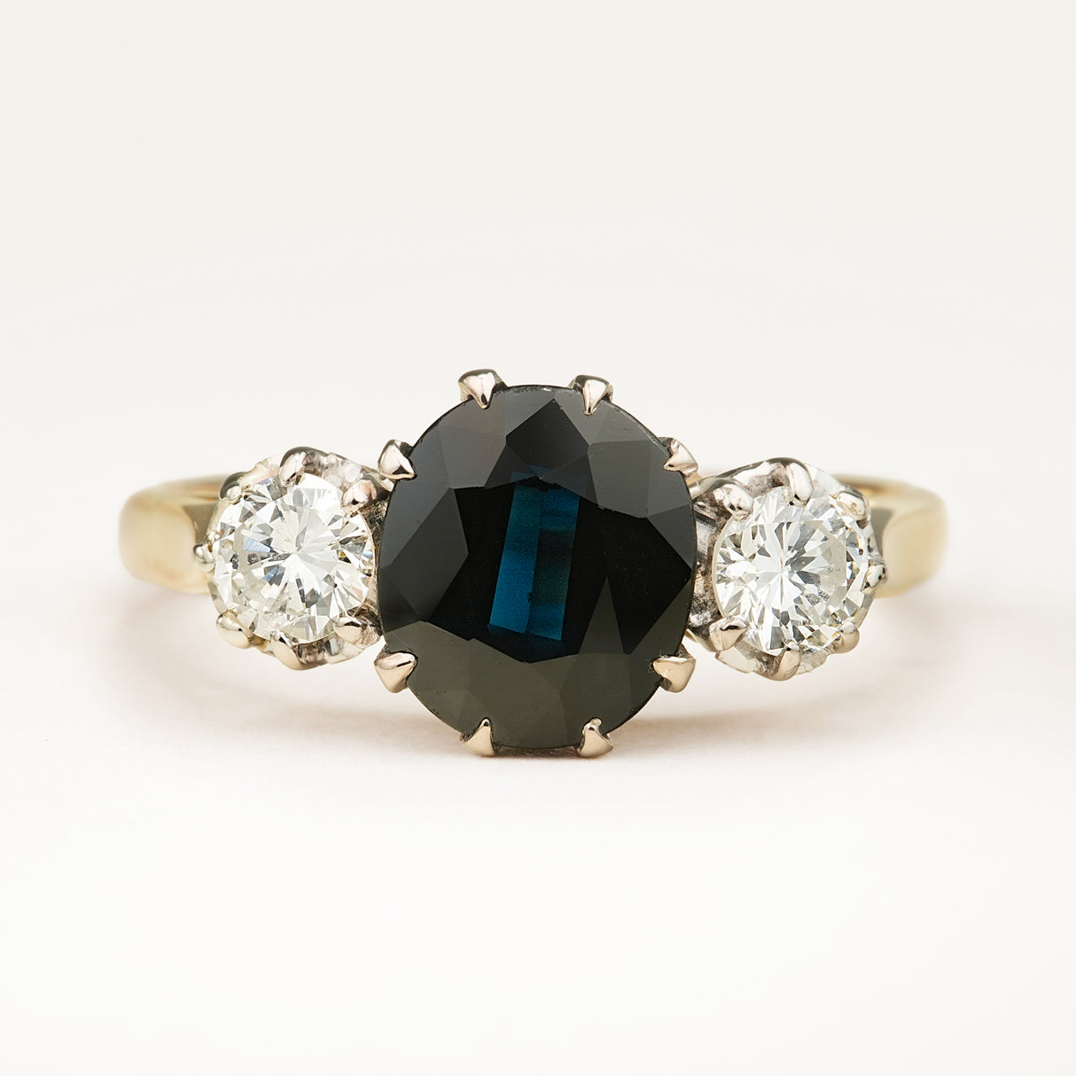 Vintage, 1950s dark blue sapphire and diamond three-stone engagement ring