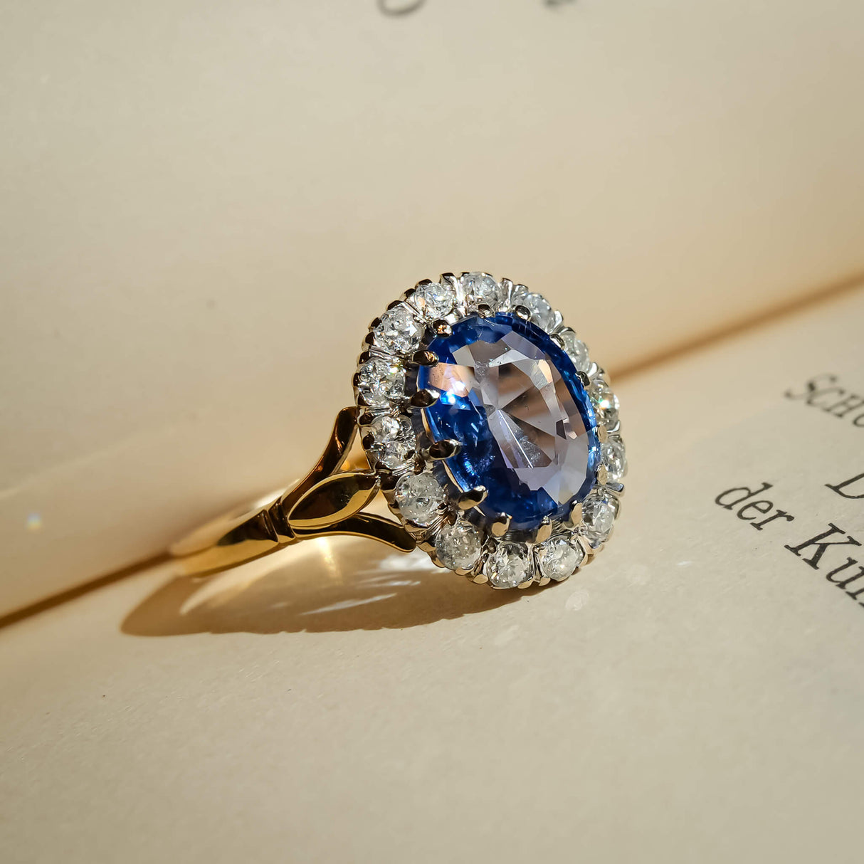 1980s sapphire center stone with diamond cluster halo ring