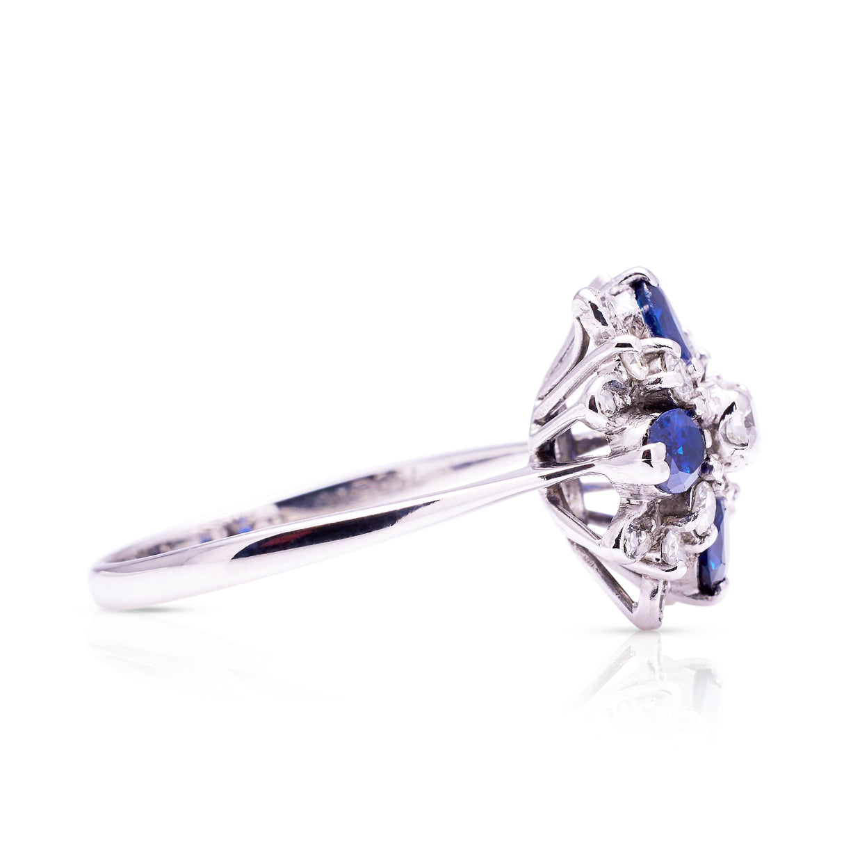 Sapphire and diamond cluster ring from 80s, side view.
