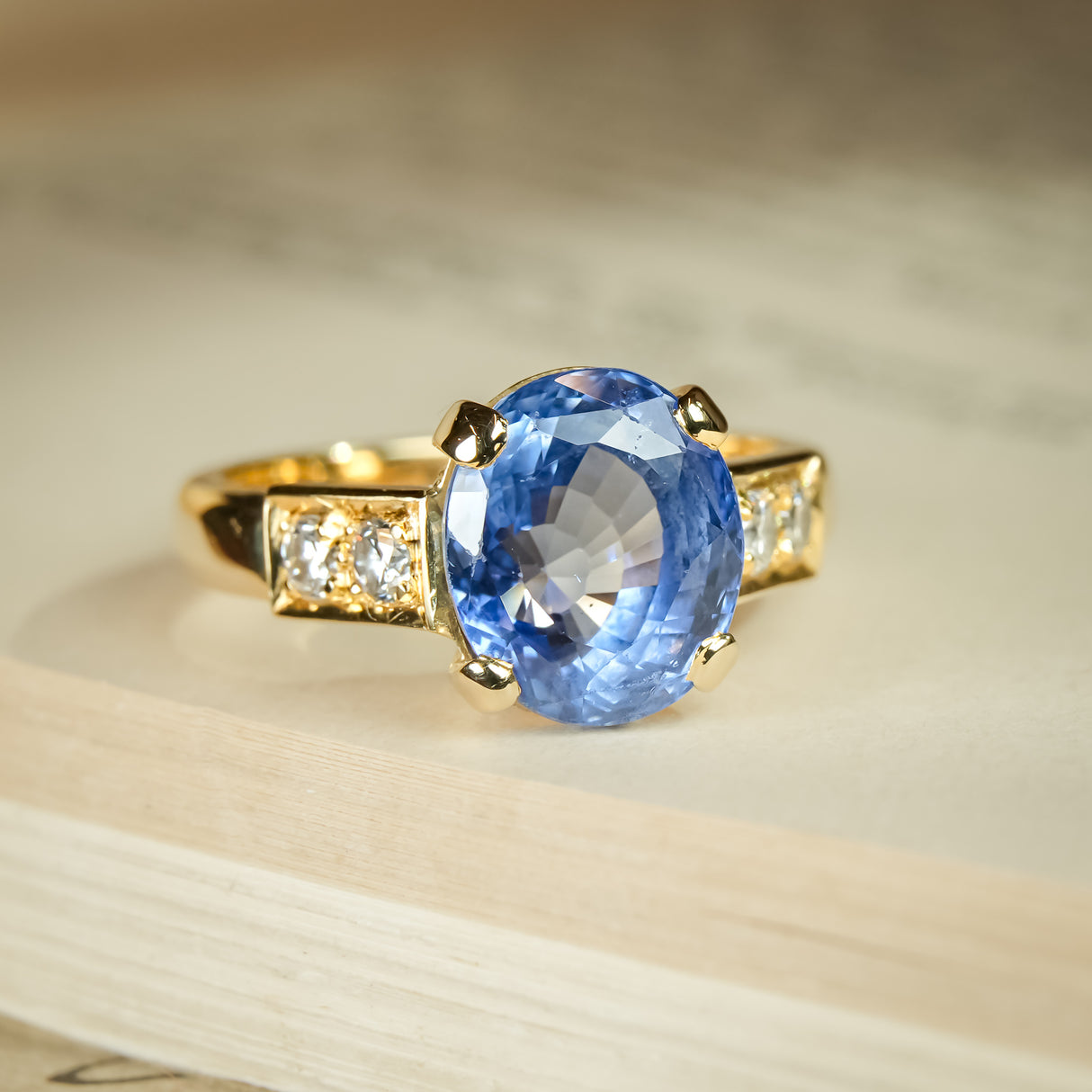 1990s sapphire and diamond engagement ring with oval blue gemstone
