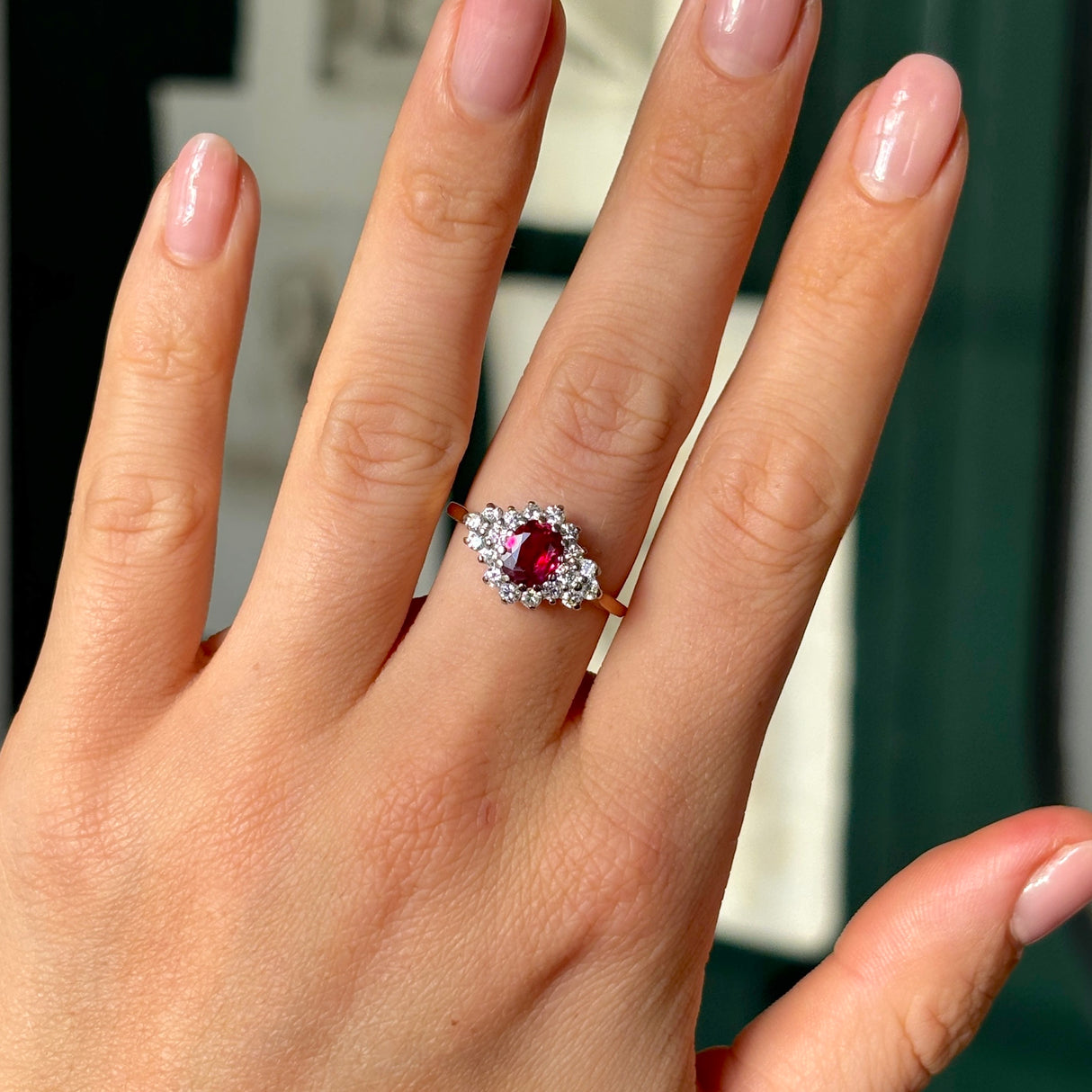 Vintage, 1970s ruby & diamond cluster ring worn on hand.