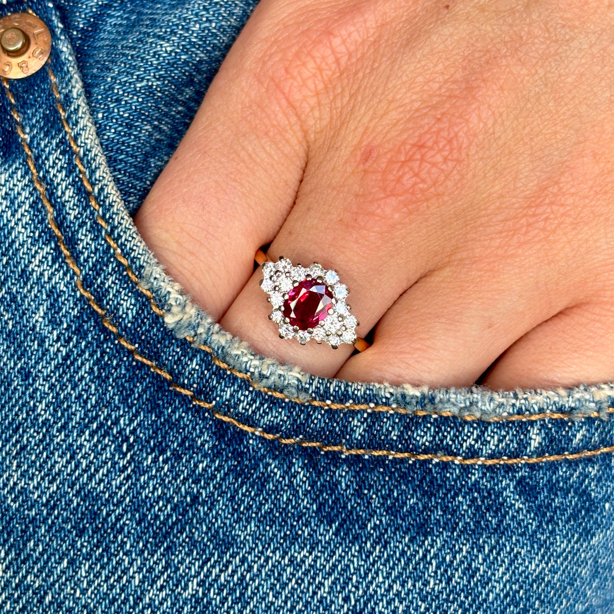 Vintage, 1970s ruby & diamond cluster ring worn on hand.