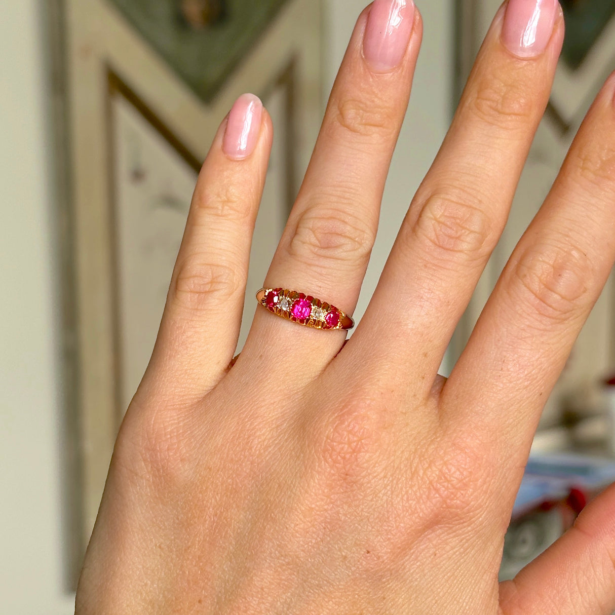 Antique, Edwardian pink sapphire & diamond five-stone ring, 18ct yellow gold worn on hand.