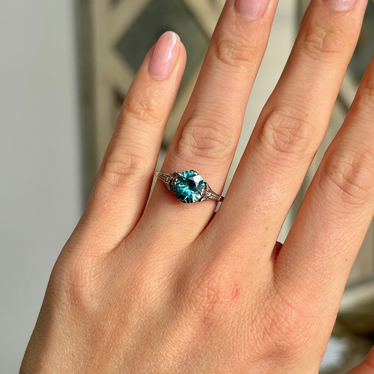 Vintage, Art Deco zircon ring, 18ct white gold worn on hand.