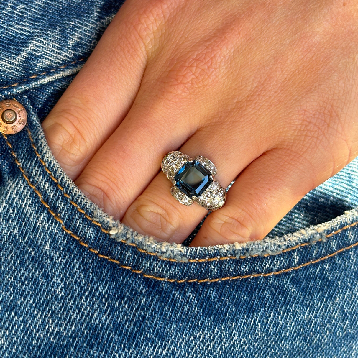 Vintage, Art Deco blue cobalt spinel & diamond ring worn on hand.