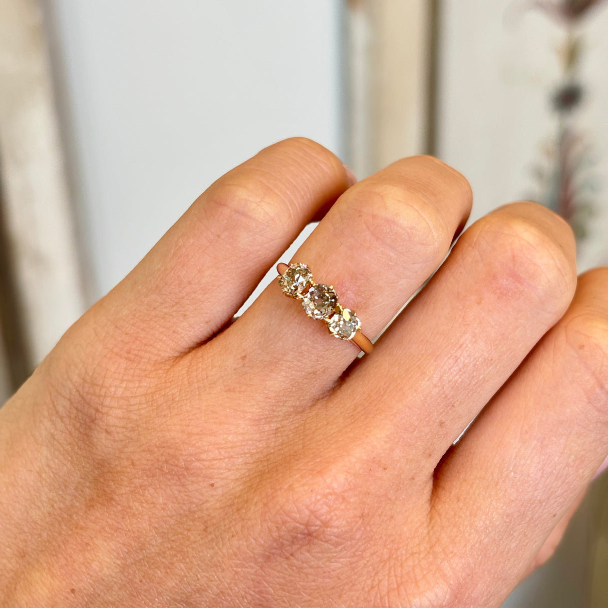 Antique, old-cut yellow-brown diamond three-stone ring