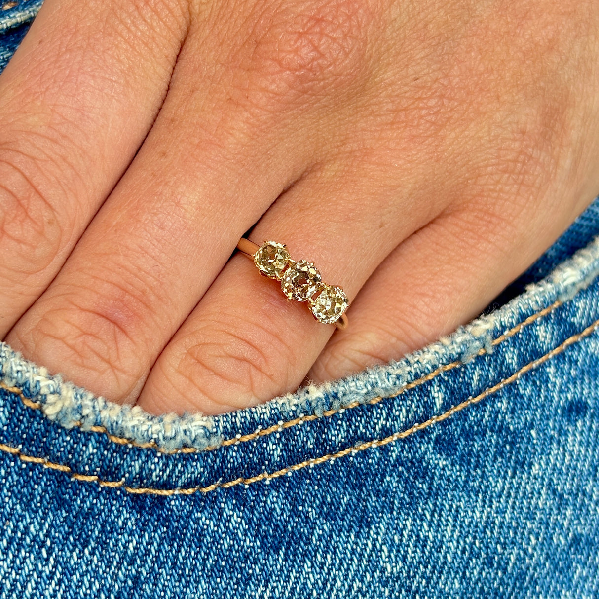 Antique, old-cut yellow-brown diamond three-stone ring