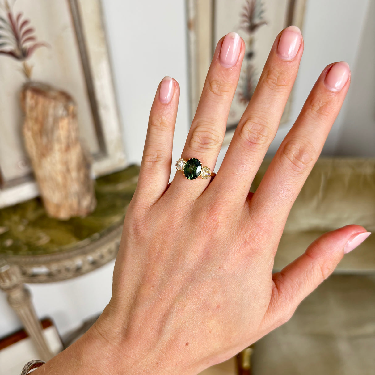A ring set with a 1950s green sapphire and 18th century rose-cut diamonds