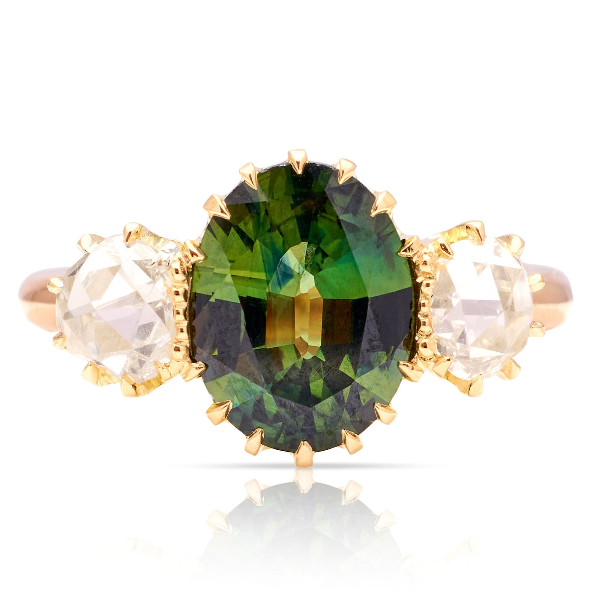 A ring set with a 1950s green sapphire and 18th century rose-cut diamonds