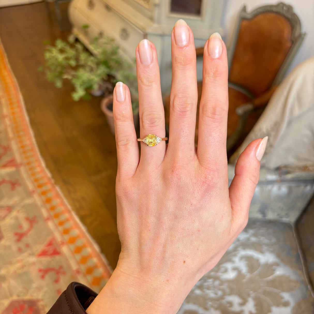 Yellow sapphire and diamond three-stone ring