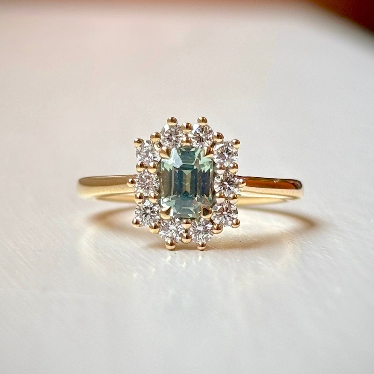 Octagon-cut green sapphire & diamond cluster engagement ring