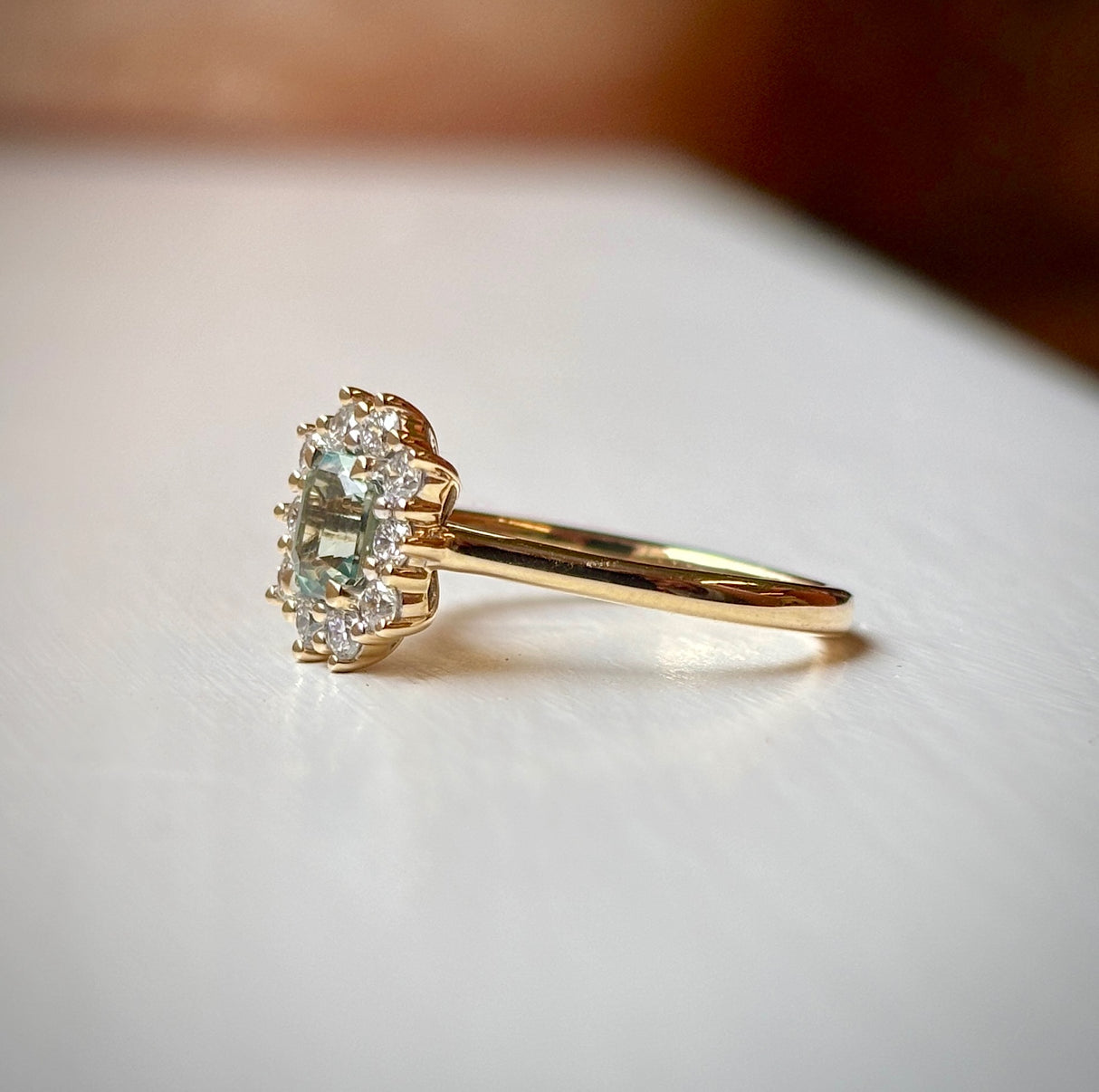 Octagon-cut green sapphire & diamond cluster engagement ring