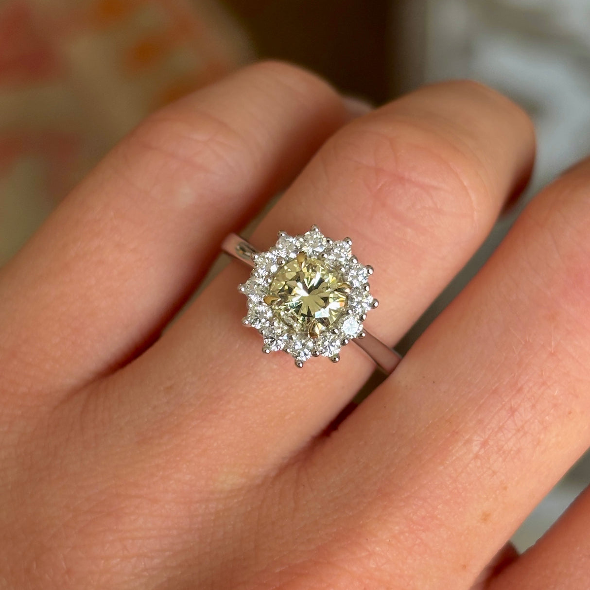 Tinted yellow 1.01ct diamond cluster engagement ring