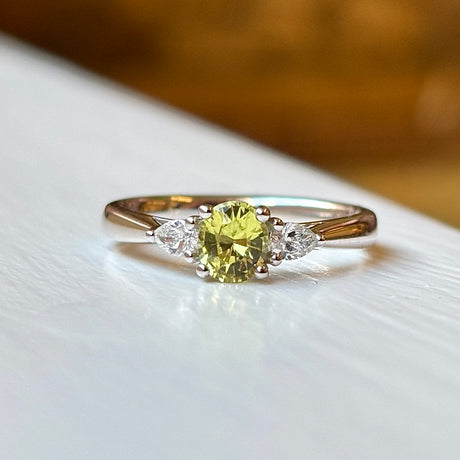 Oval-cut yellow sapphire & diamond three-stone ring