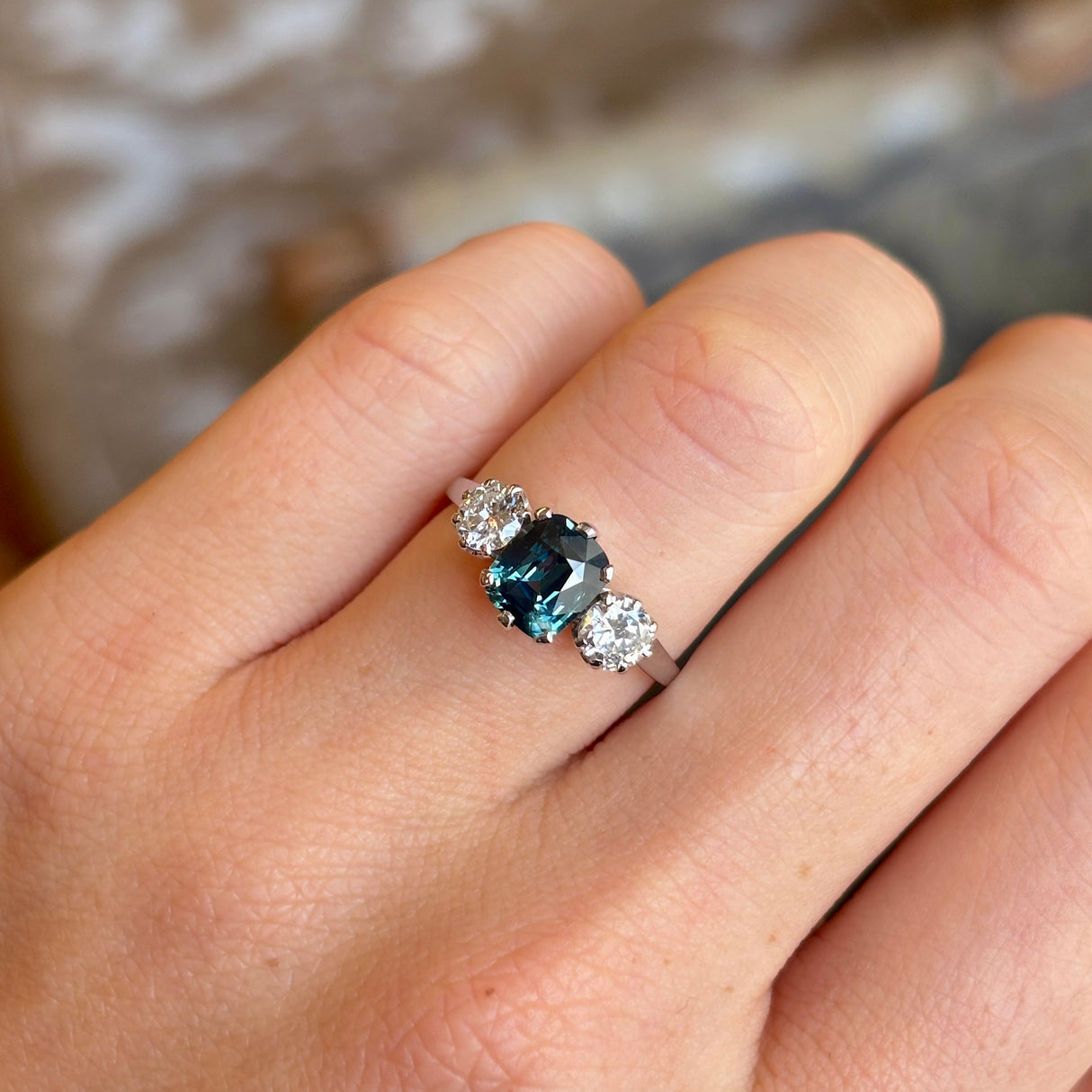 Vintage, 1950s Green-teal sapphire & diamond three-stone ring