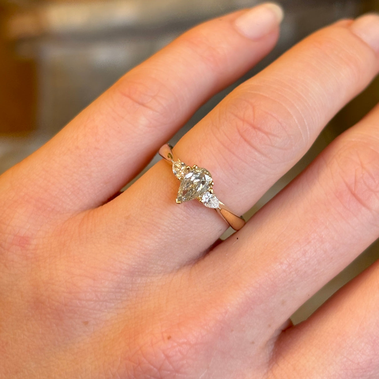 Pear-cut diamond three-stone engagement ring