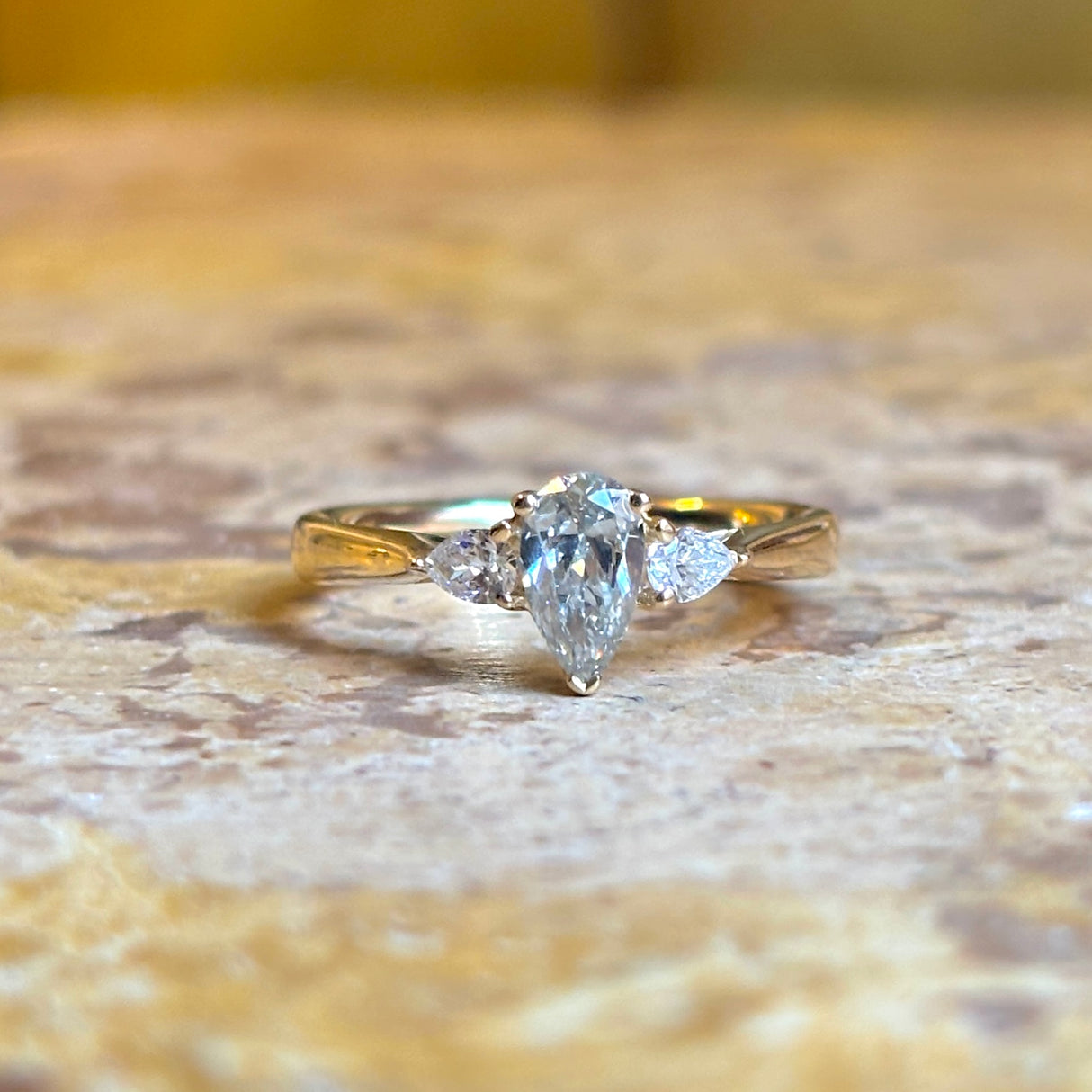 Pear-cut diamond three-stone engagement ring