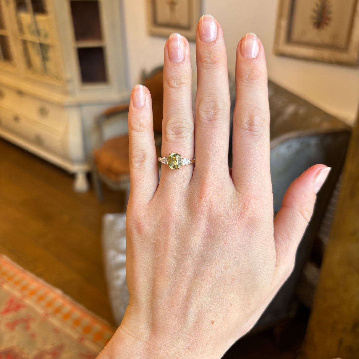 Emerald-cut yellow sapphire and diamond three-stone ring