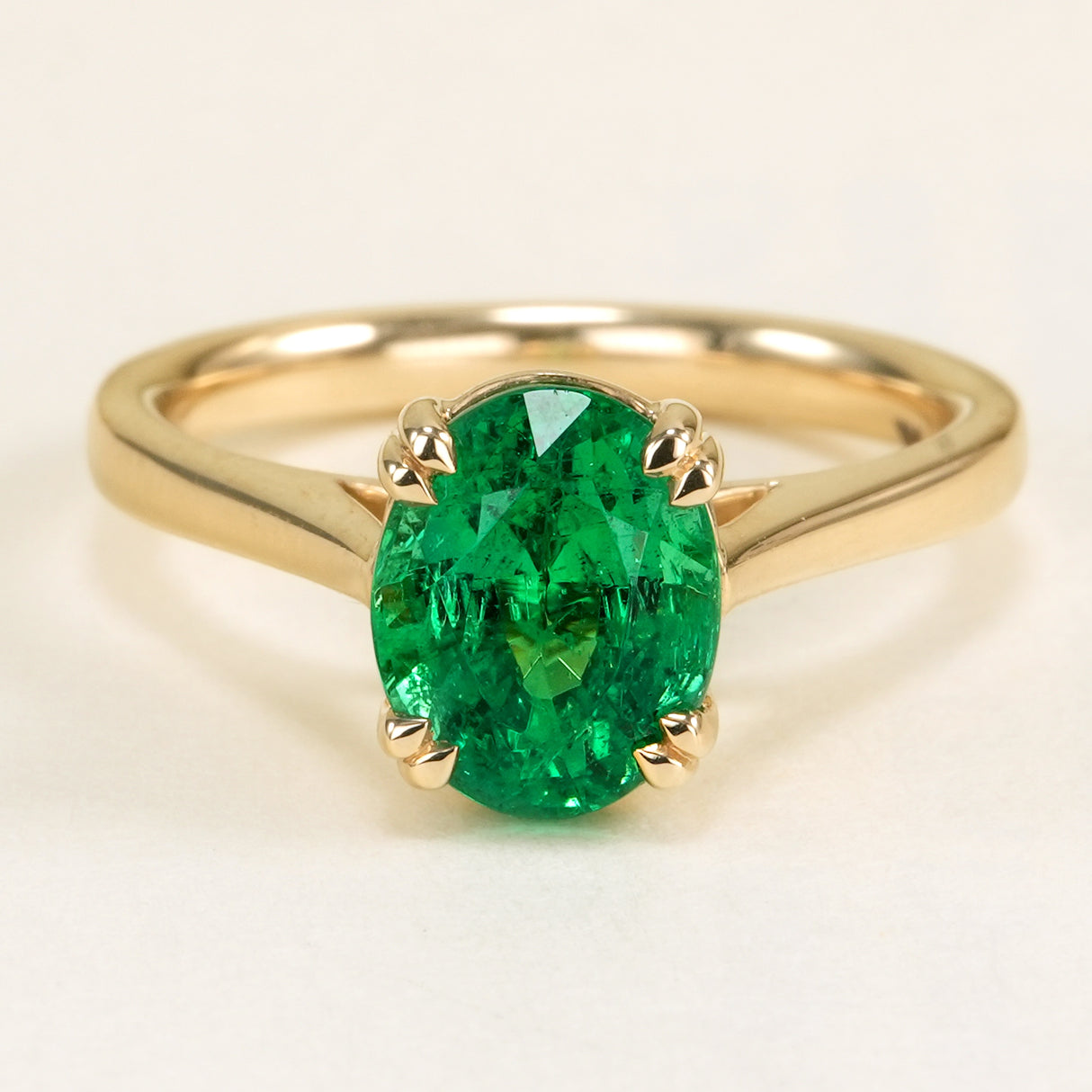 Oval-cut 2ct emerald single-stone ring