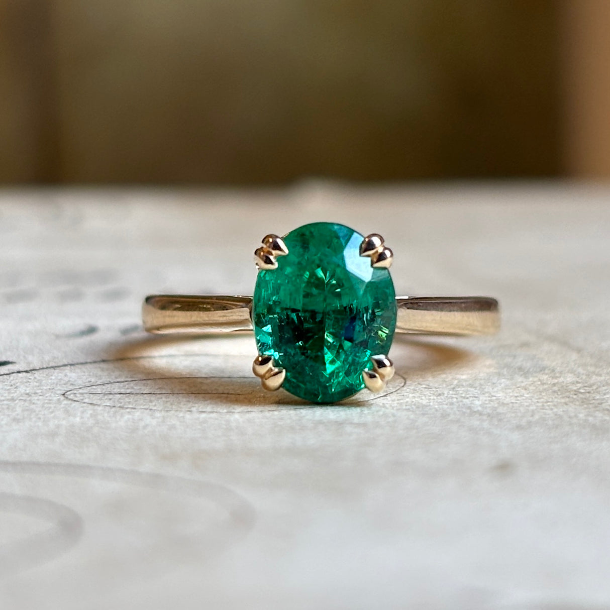 Oval-cut 2ct emerald single-stone ring