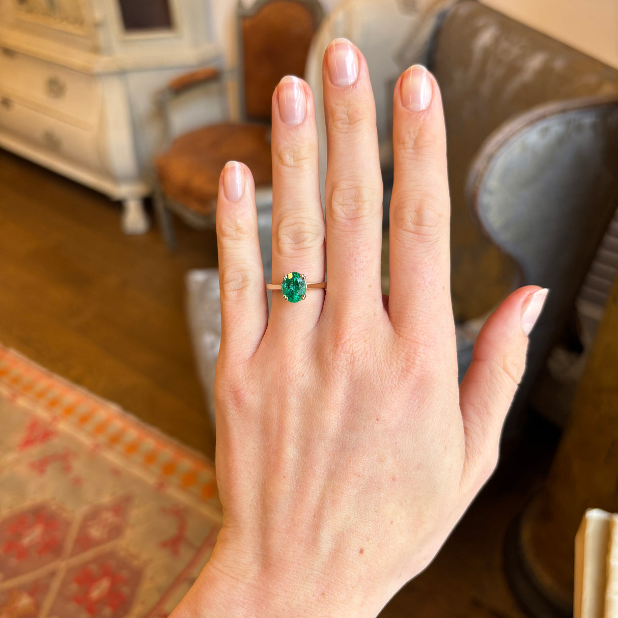 Oval-cut emerald single-stone ring