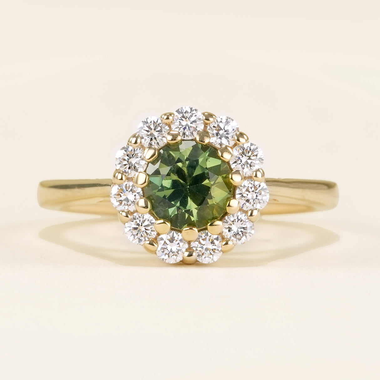 Green sapphire & diamond cluster engagement ring