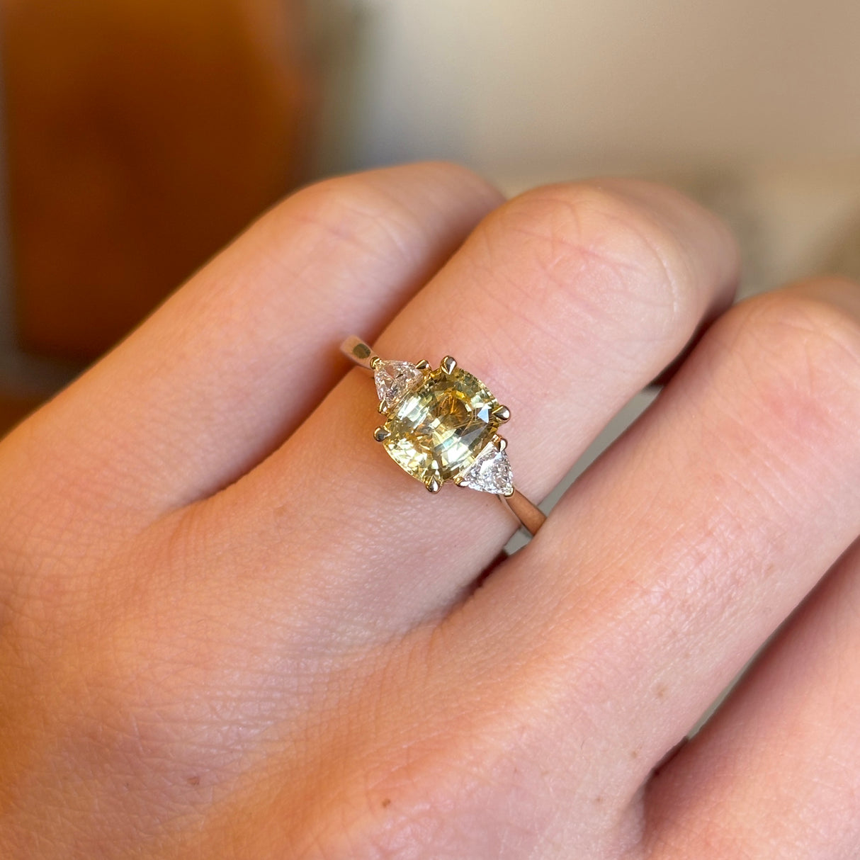 Yellow sapphire and diamond three-stone ring