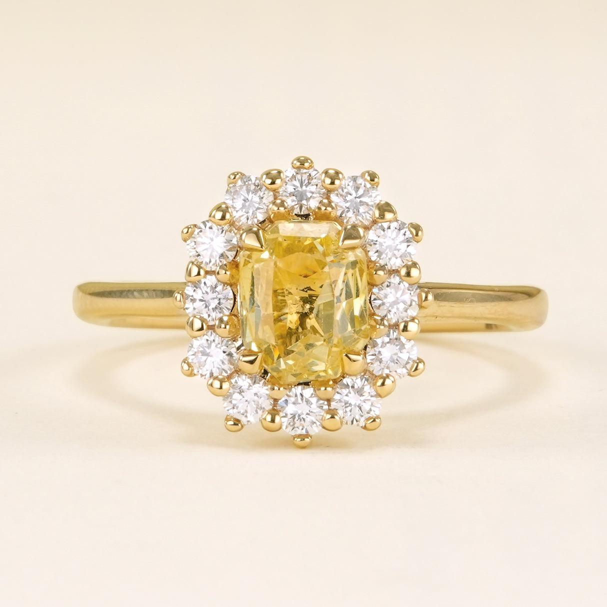 Yellow sapphire and diamond cluster engagement ring