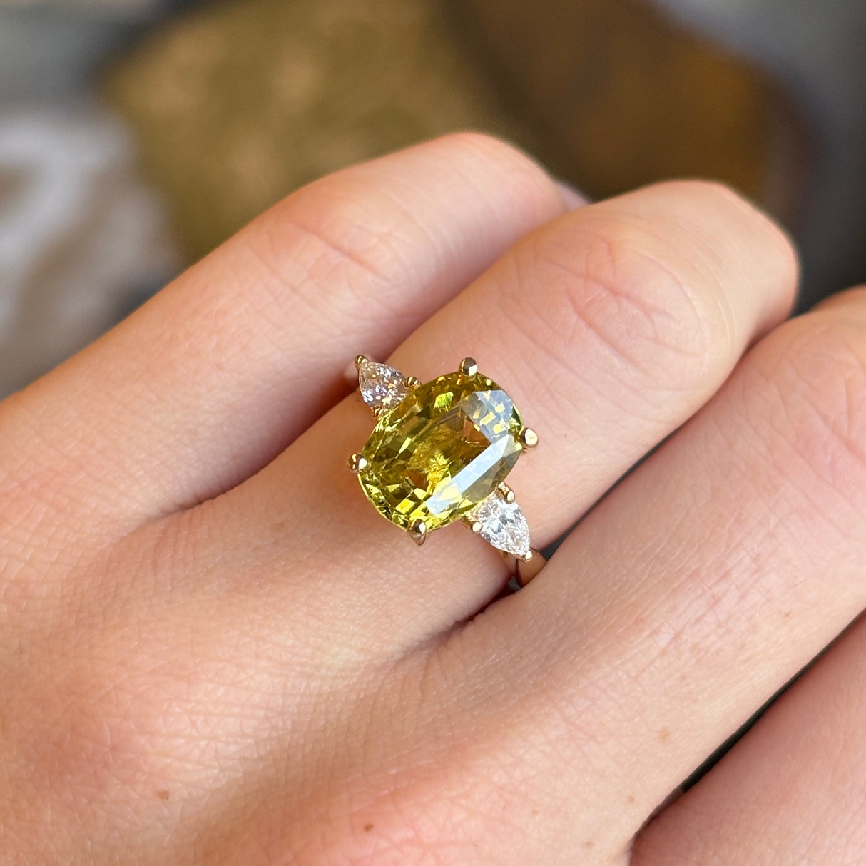 Chrysoberyl and pear-cut diamond three-stone ring
