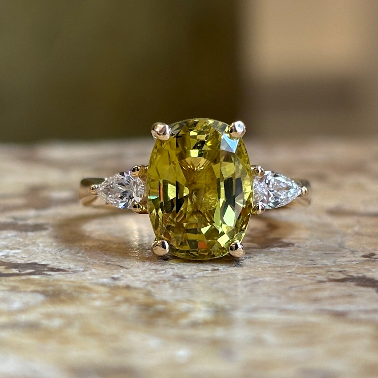 Chrysoberyl and pear-cut diamond three-stone ring