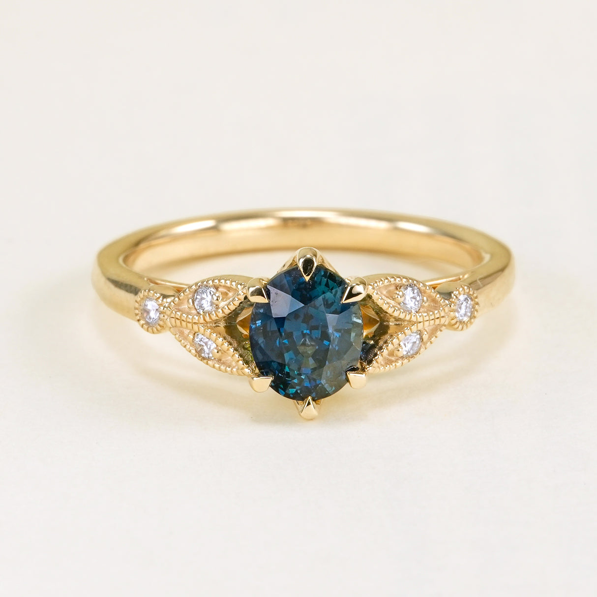 Deep blue sapphire and diamond engagement ring