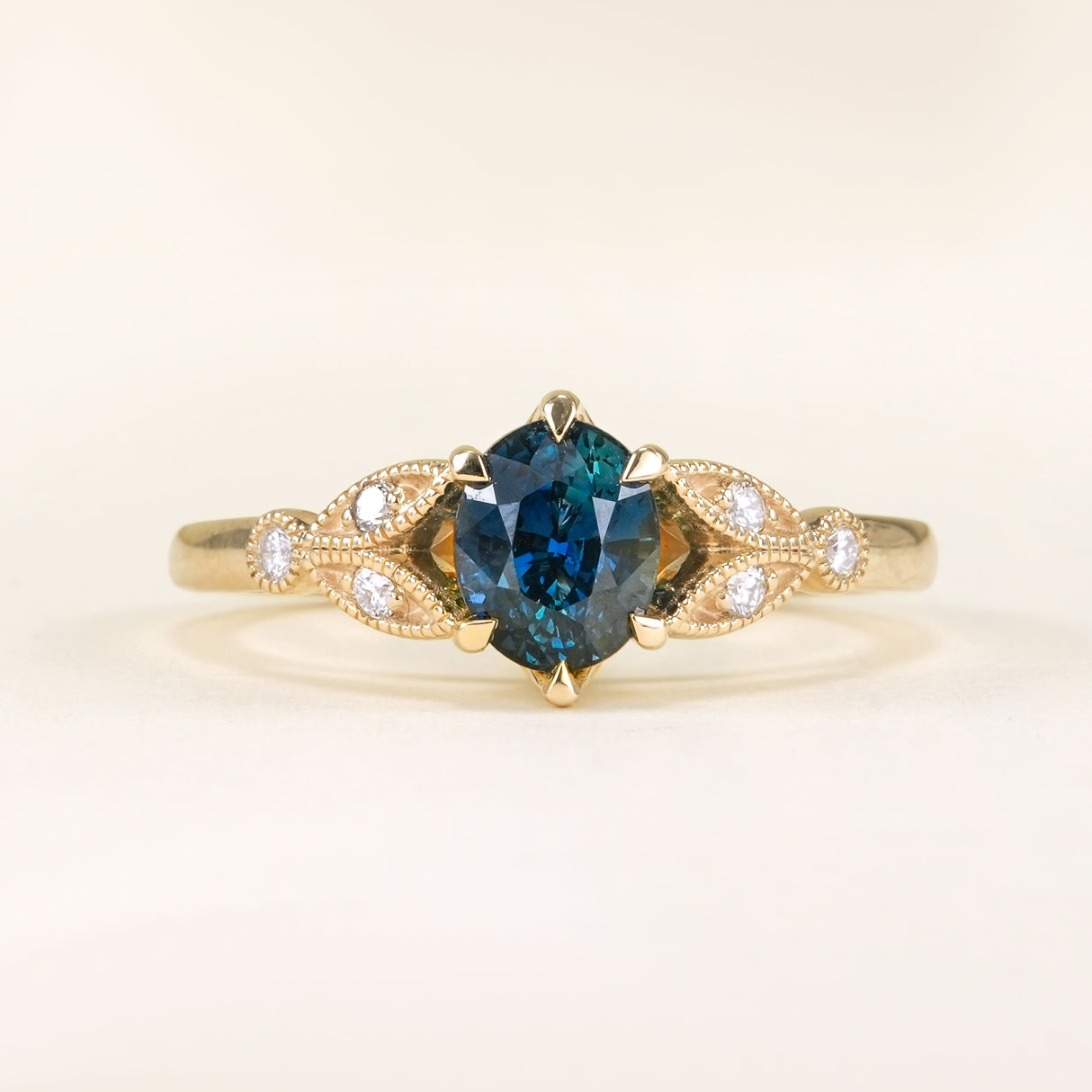 Deep blue sapphire and diamond engagement ring