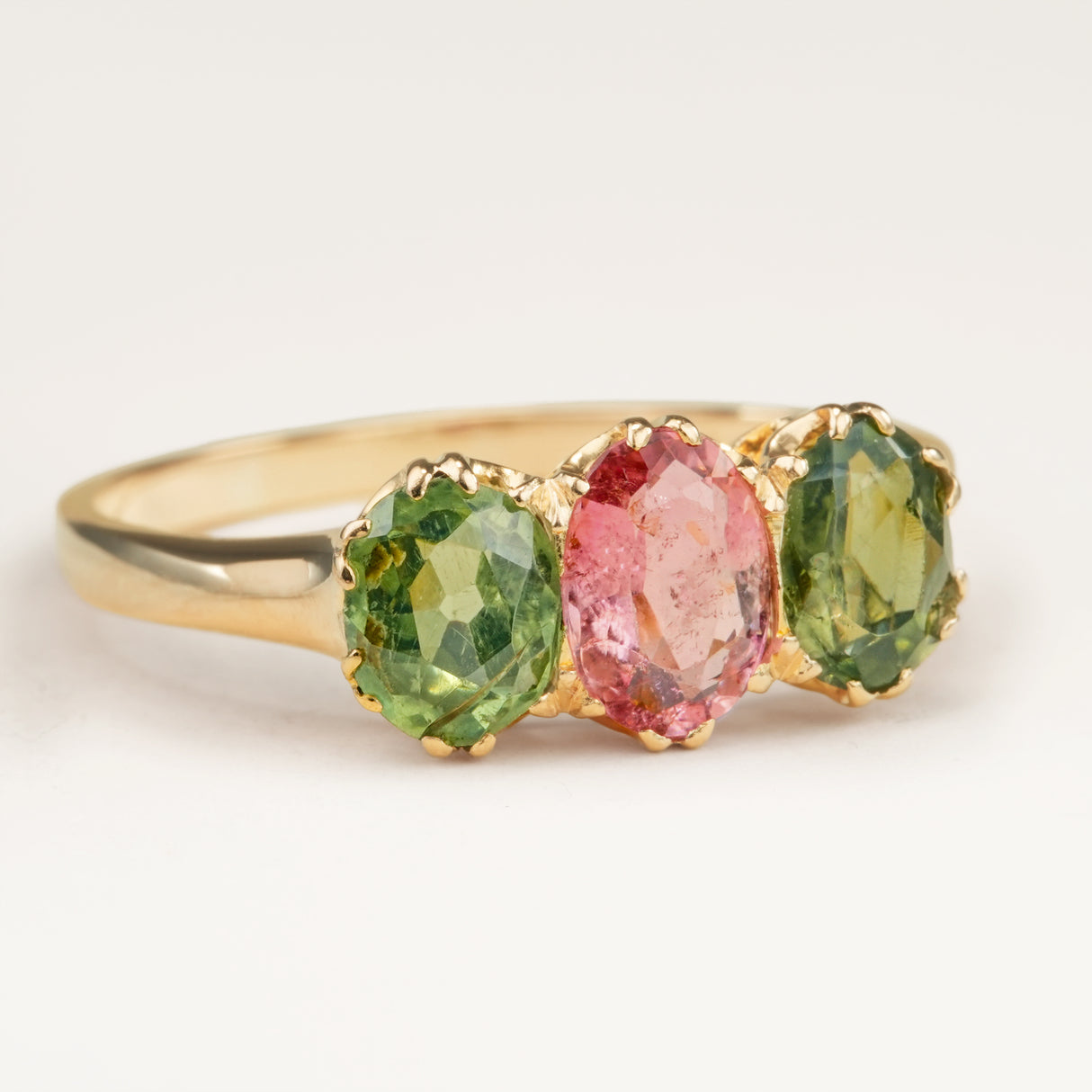 Antique, Edwardian pink tourmaline and green zircon three-stone engagement ring