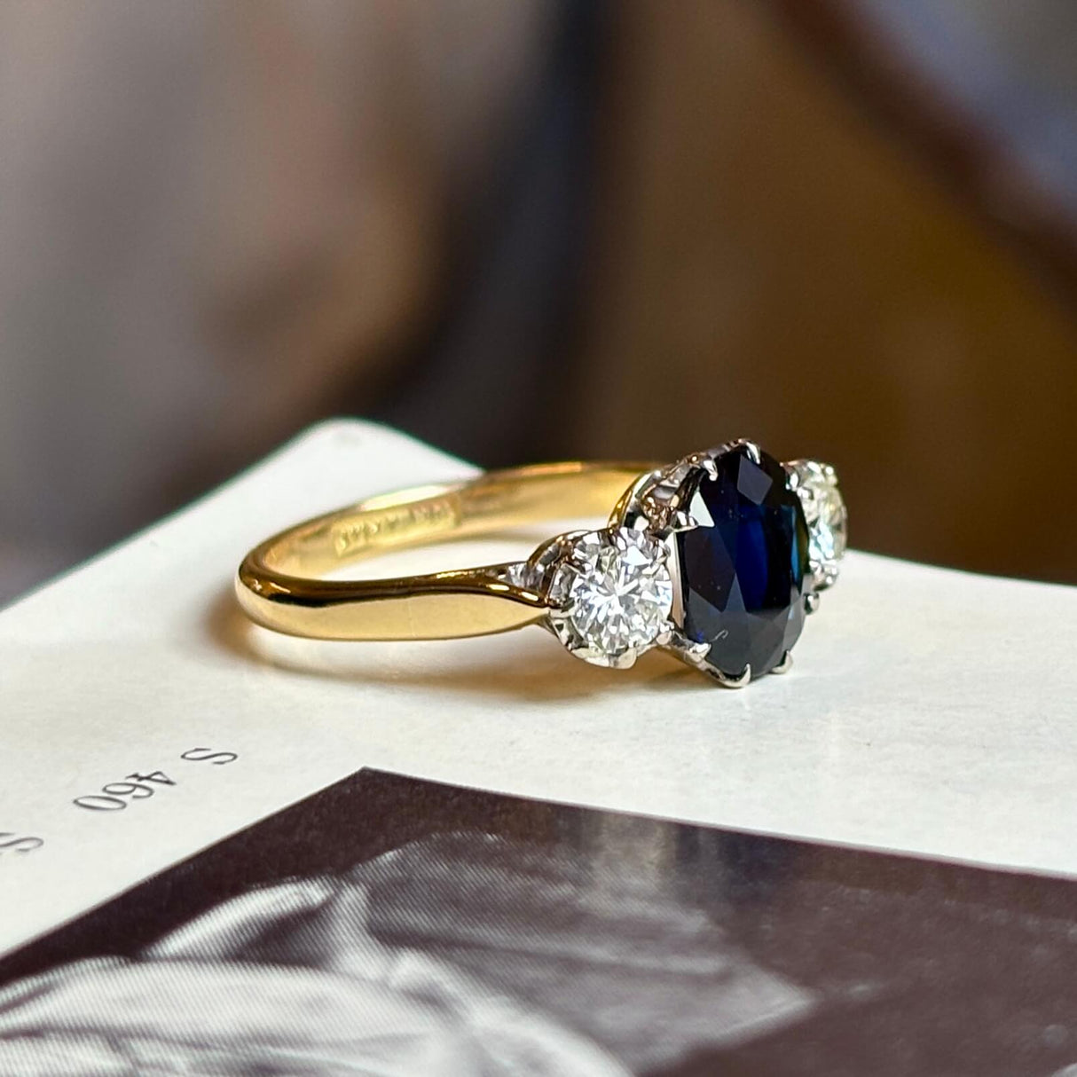 Vintage, 1950s dark blue sapphire and diamond three-stone engagement ring