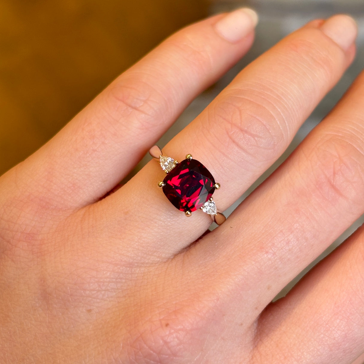 Ruby and diamond three-stone engagement ring