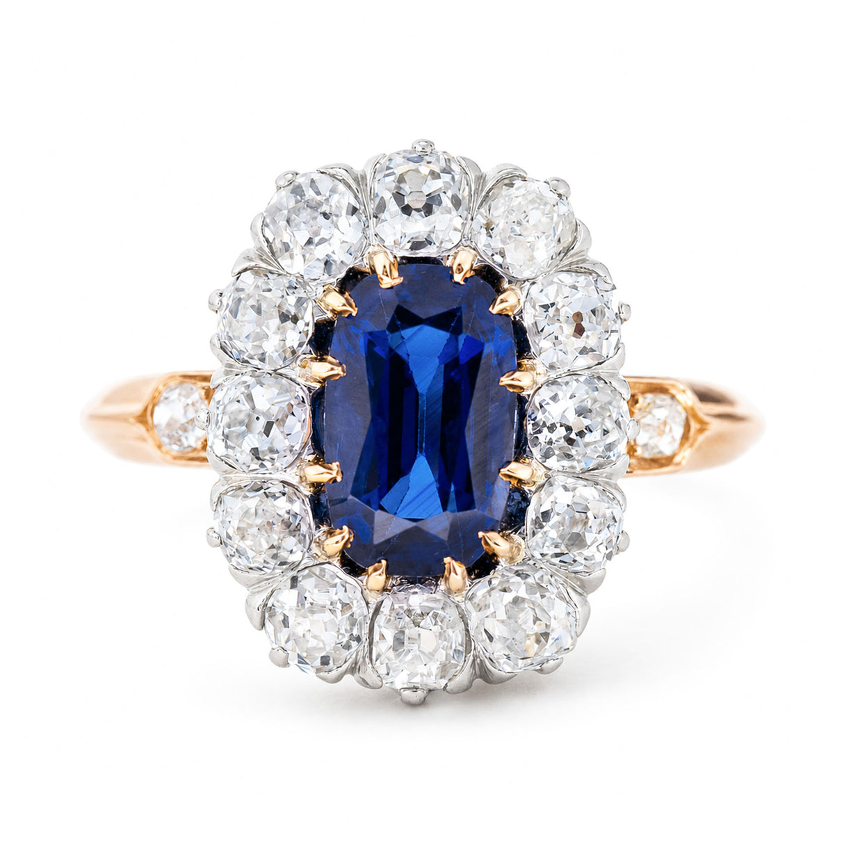 A close-up of an antique, Jugendstil Royal-blue sapphire and diamond cluster ring.