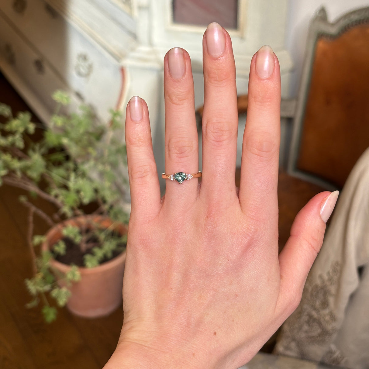 Green sapphire and diamond three-stone engagement ring
