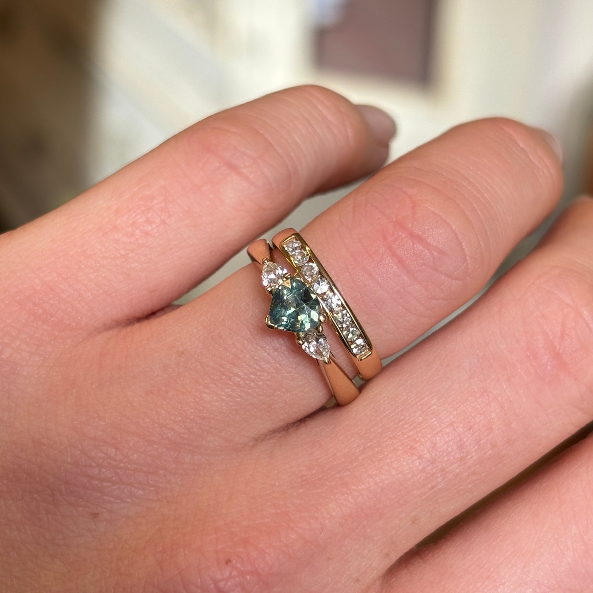Green sapphire and diamond three-stone engagement ring