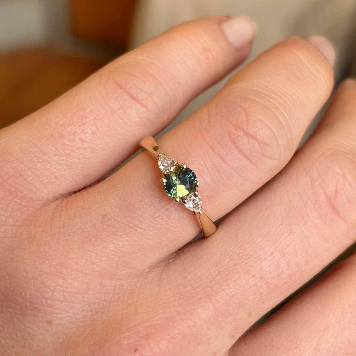 Teal sapphire and diamond three-stone engagement ring