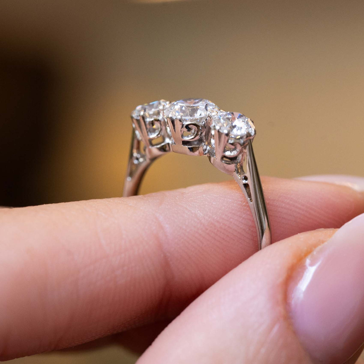 Side profile showing the ornate settings of an Edwardian diamond ring