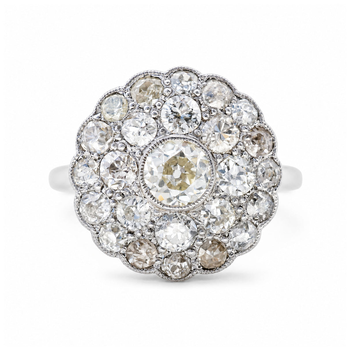 Antique Edwardian, subtly tinted old-cut diamond cluster ring